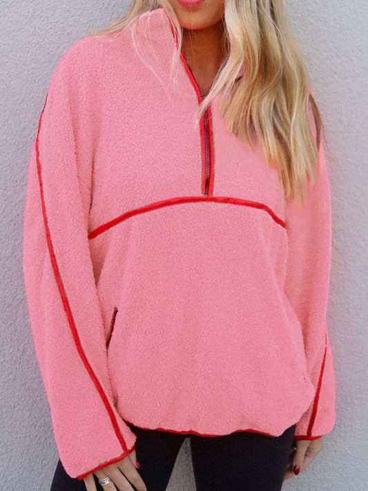 Cozy half zip sweatshirt with faux leather trim and sherpa contrast, featuring a front pocket.