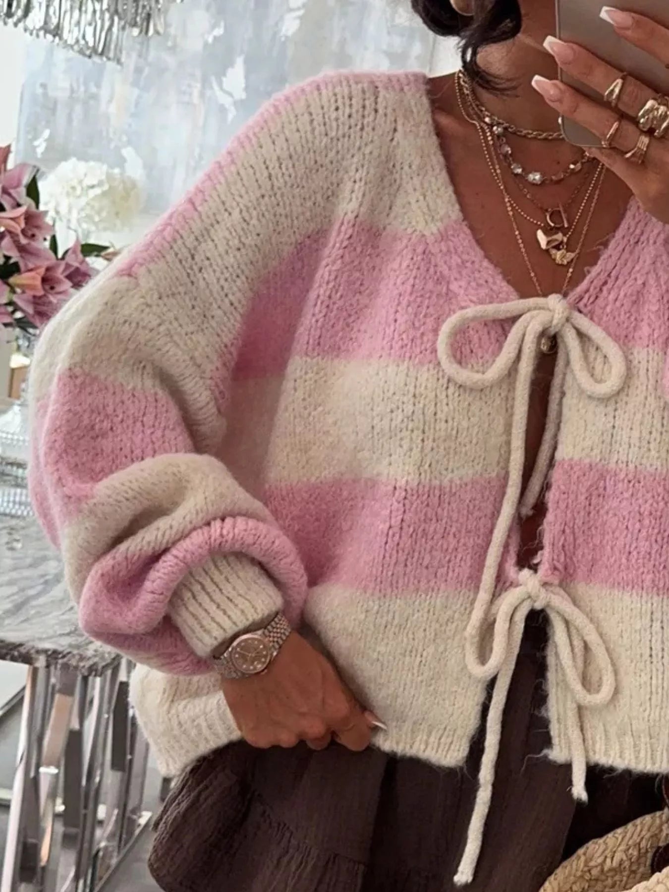 Striped tie-front cardigan in slightly stretchy polyester with long sleeves.