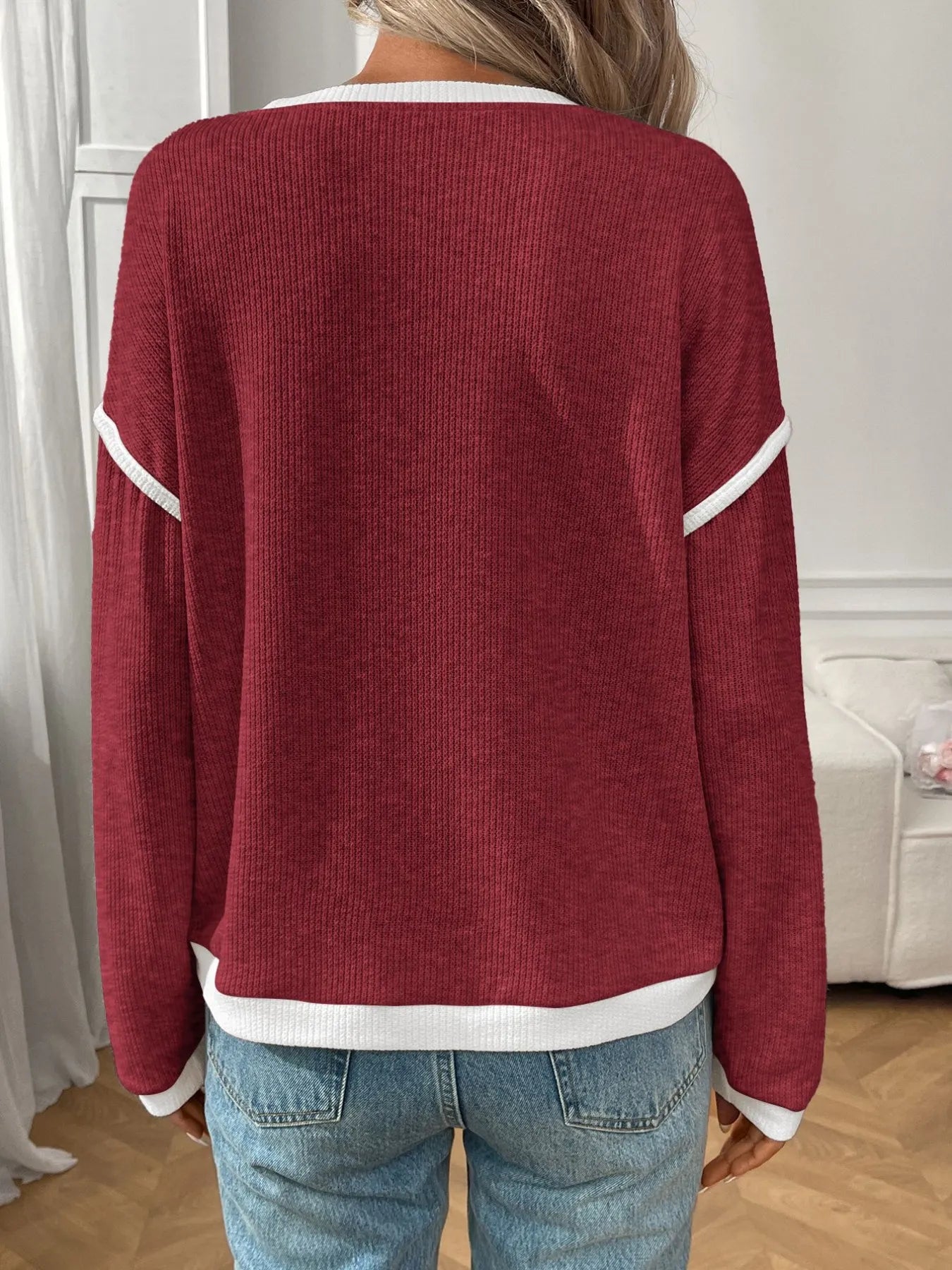 Ribbed long sleeve top with contrast trim and stretch fabric in a fitted silhouette.