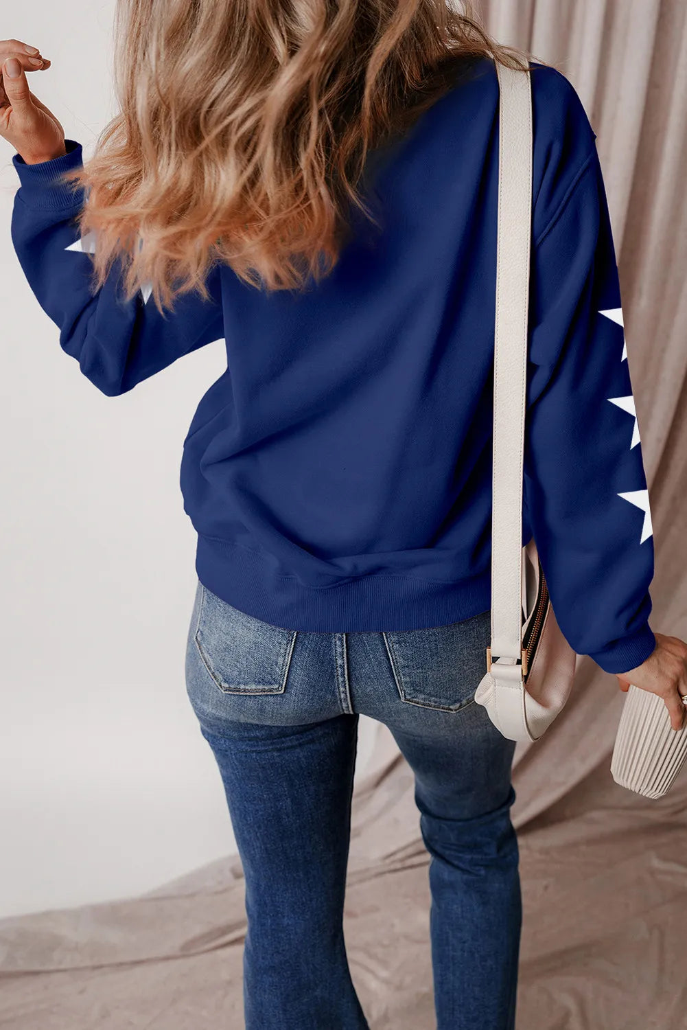 Gray long sleeve sweatshirt with a glitter sheer design and cotton blend material.