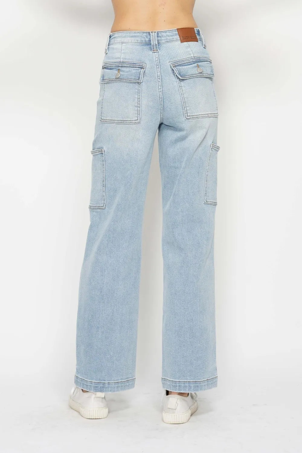 Rear view of Judy Blue high-waist straight cargo jeans in light wash with multiple pockets.