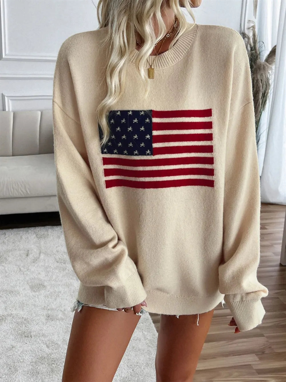 Long sleeve round neck knit top featuring a US flag design in an acrylic blend.