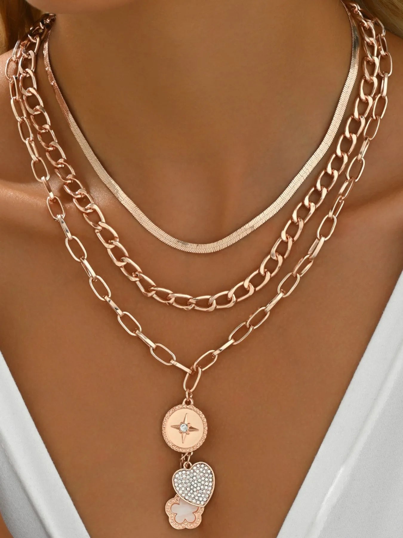 18K gold-plated stainless steel layered necklace with heart and star pendants.