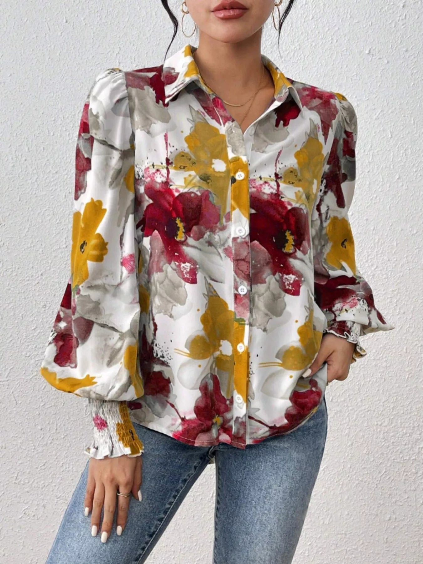 Printed button-up shirt with lantern sleeves in a polyester blend fabric.