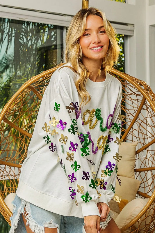 Lightweight pullover with Fleur De Lis sleeve designs in soft-washed fabric for comfort.