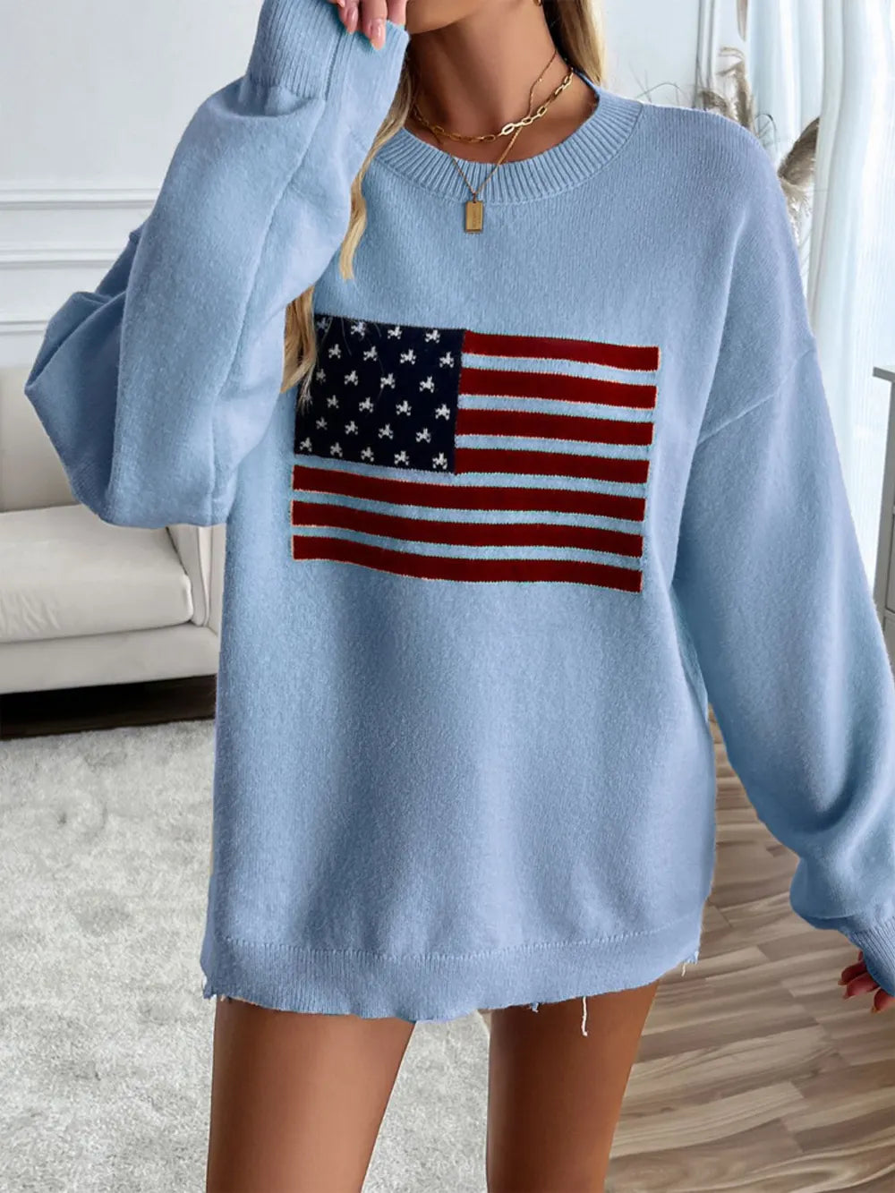 Long sleeve round neck top with US flag design in an acrylic blend fabric.