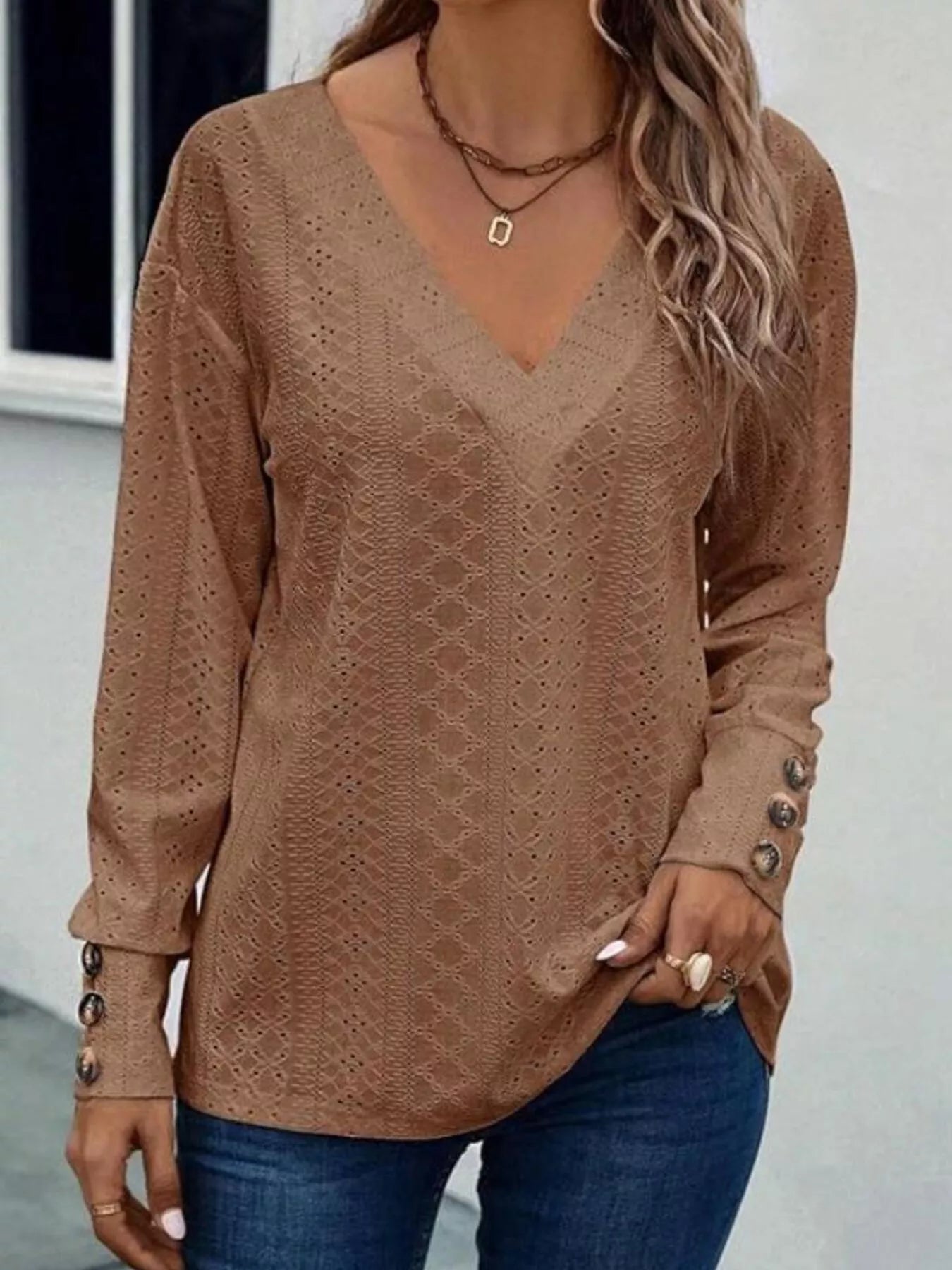 Long sleeve eyelet V-neck blouse in polyester blend with decorative buttons in white color