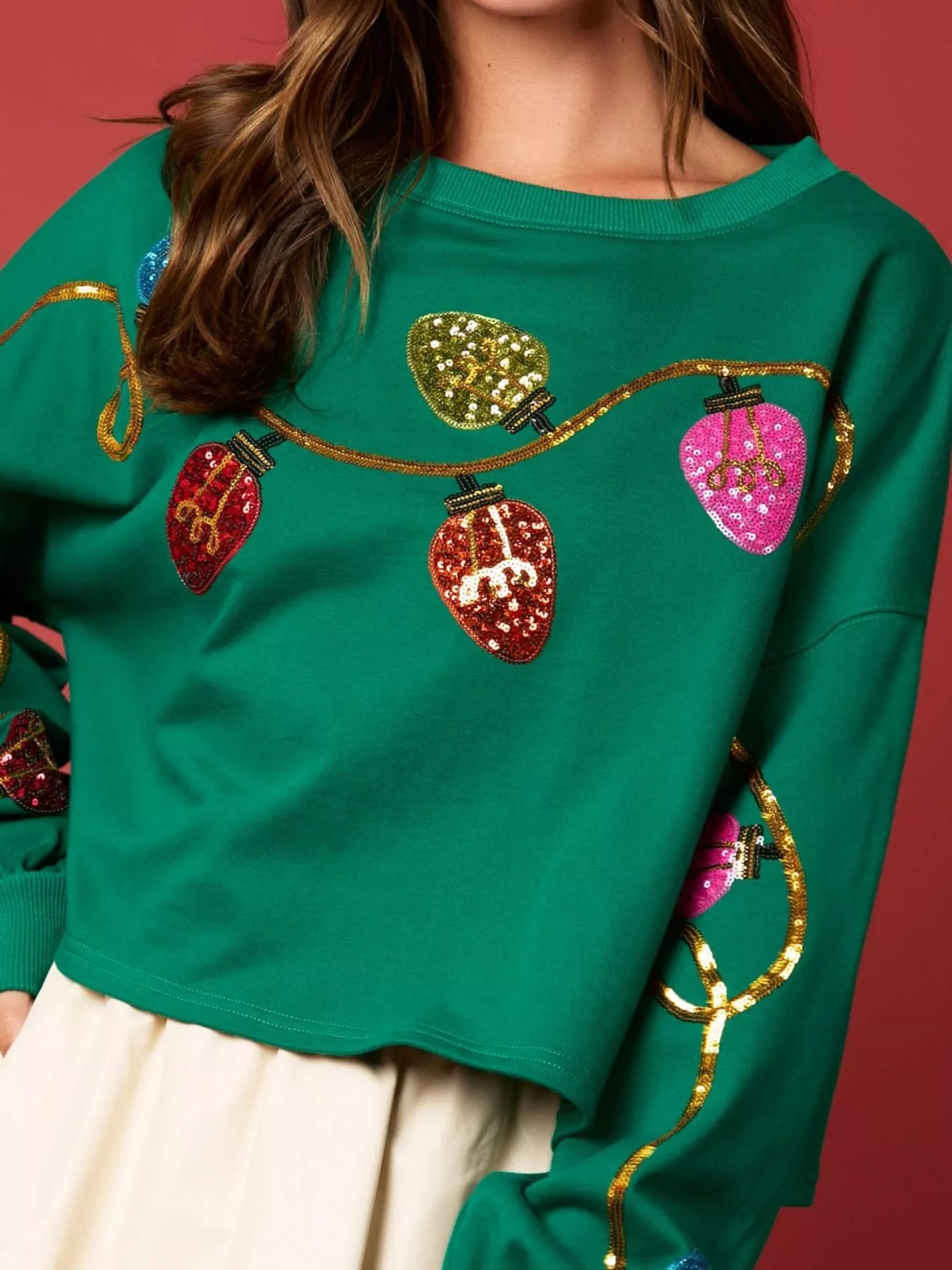 Sequin embellished polyester sweatshirt with long sleeves and a relaxed fit for holidays.