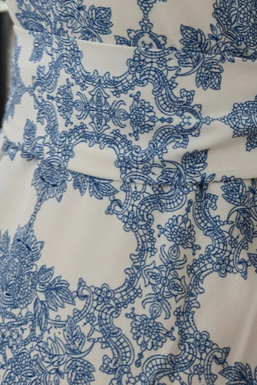Blue ikat printed maxi cami dress with intricate lace-like patterns and tied details.
