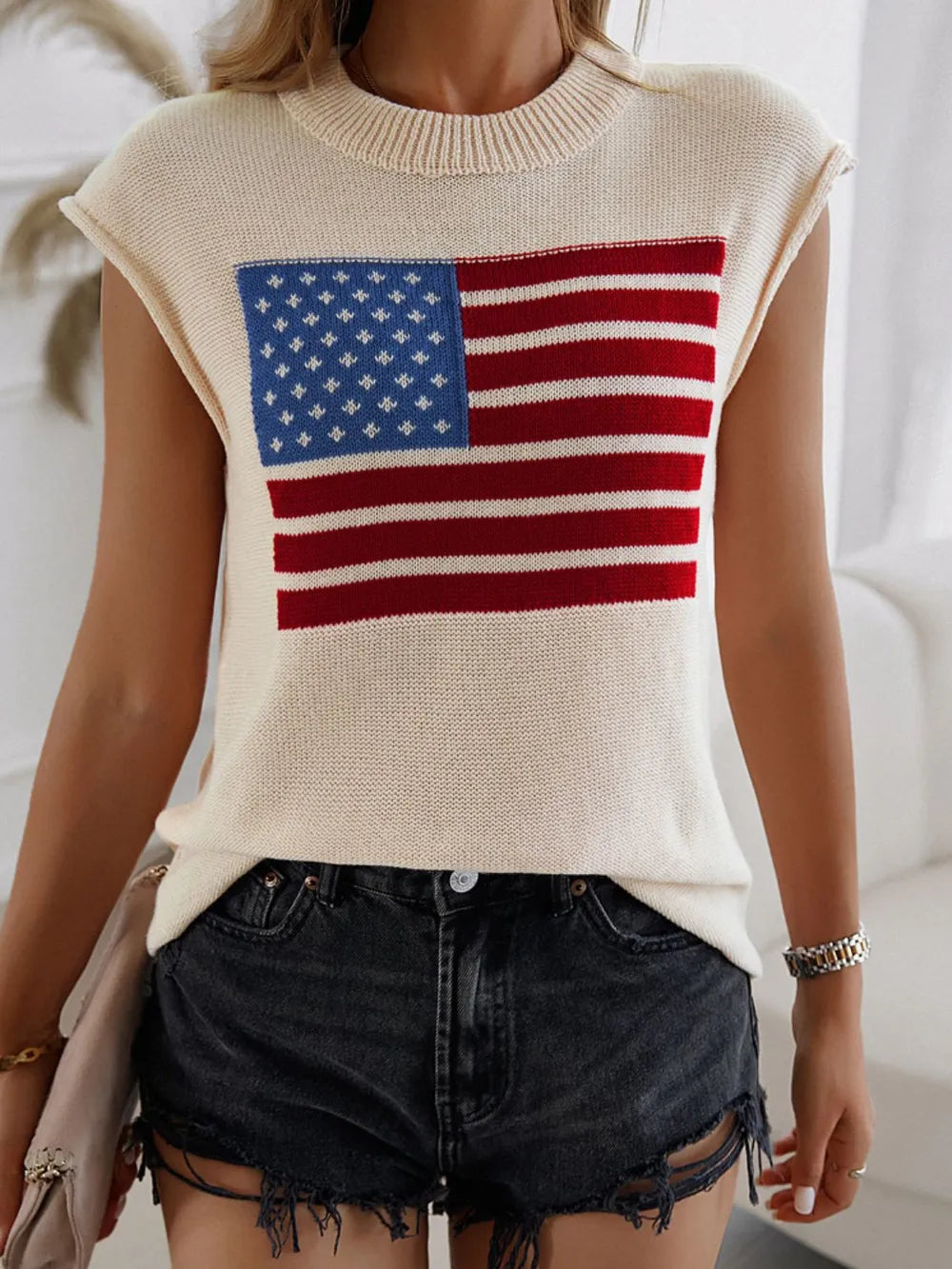 Polyester sweater vest with US flag design and round neck, moderate stretch fabric.