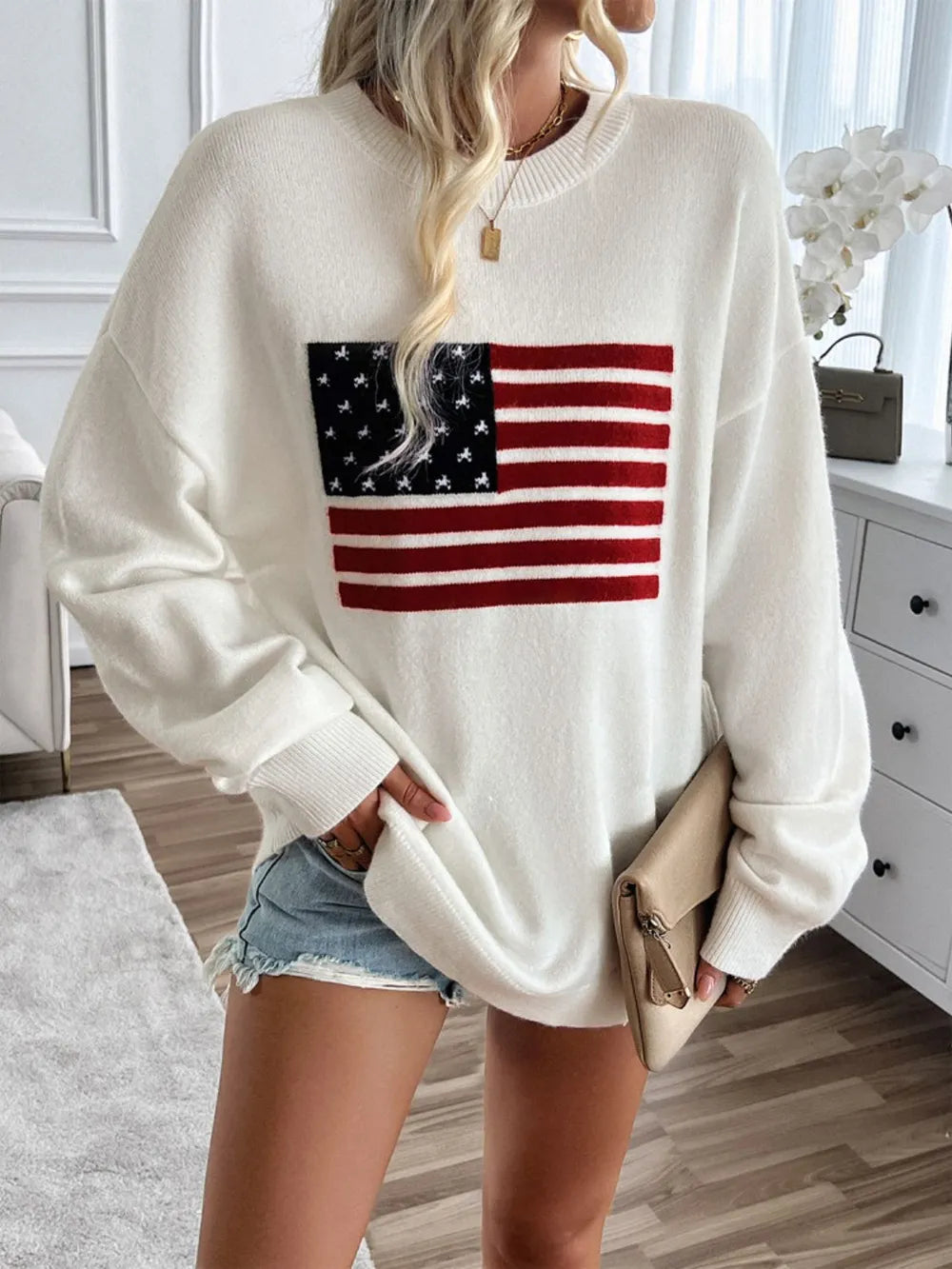 Round neck long sleeve knit top featuring the US flag design in an acrylic blend.