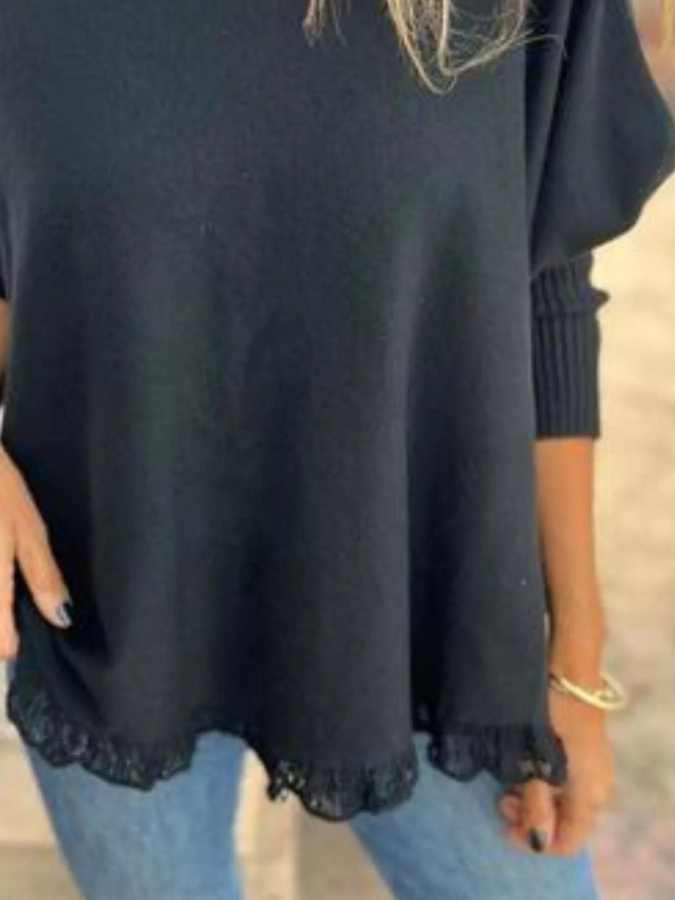 Plus size long sleeve knit top with round neck and delicate lace trim in soft fabric