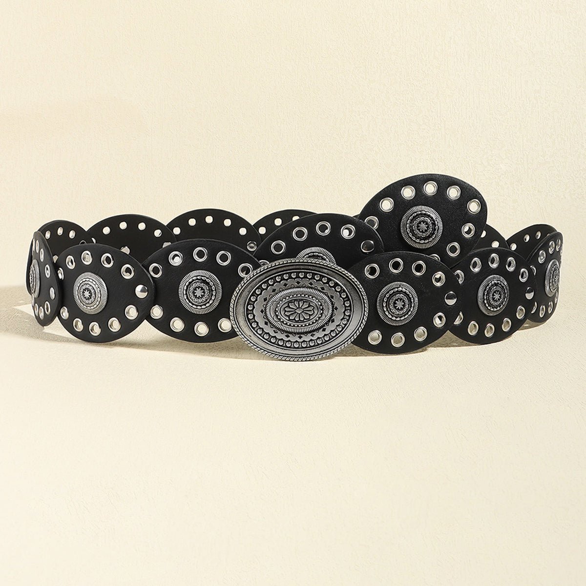 Black PU leather belt with oval silver buckle and circular stud details.