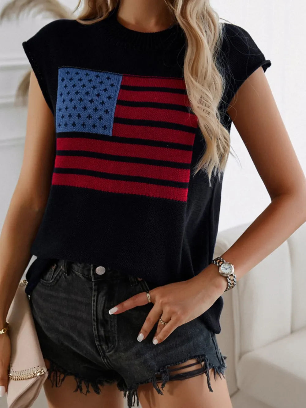 Polyester sweater vest with US flag design and round neck, moderate stretch fabric.