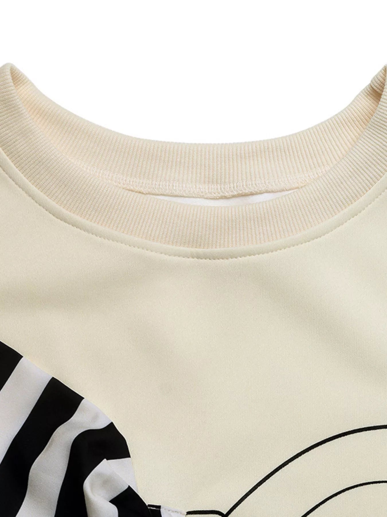 Light pink sweatshirt with bow detail, round neck, and dropped shoulders in polyester blend