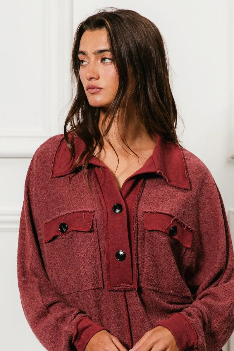 Oversized maroon French terry collared top with buttons and pockets.
