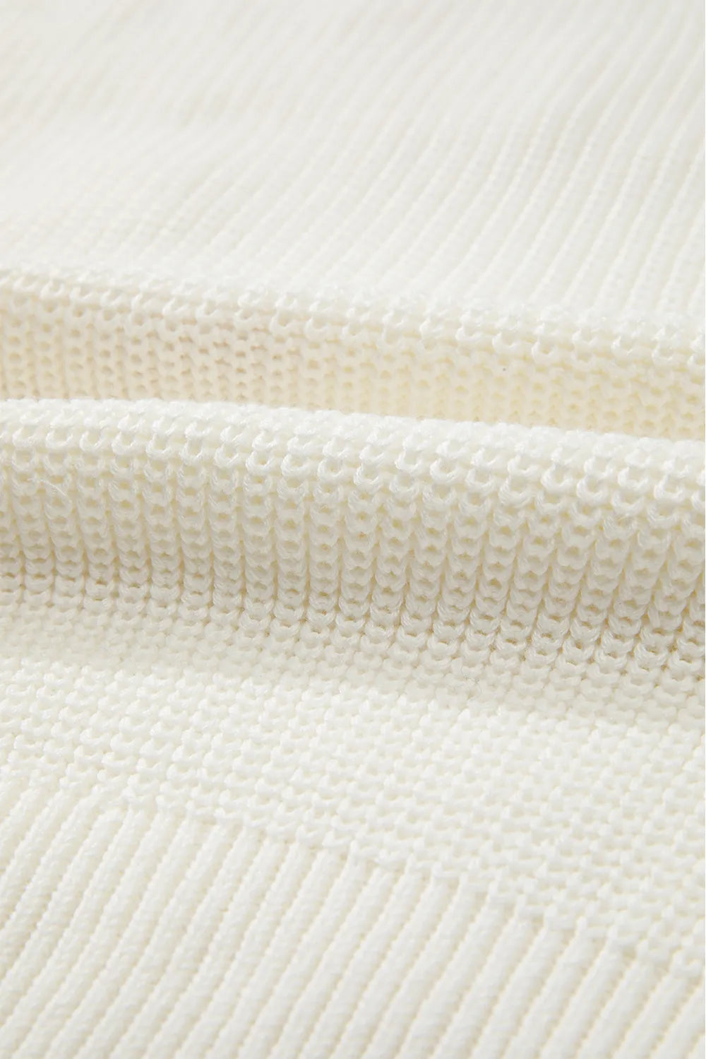 Cream acrylic cotton round neck sweater with textured knit fabric.