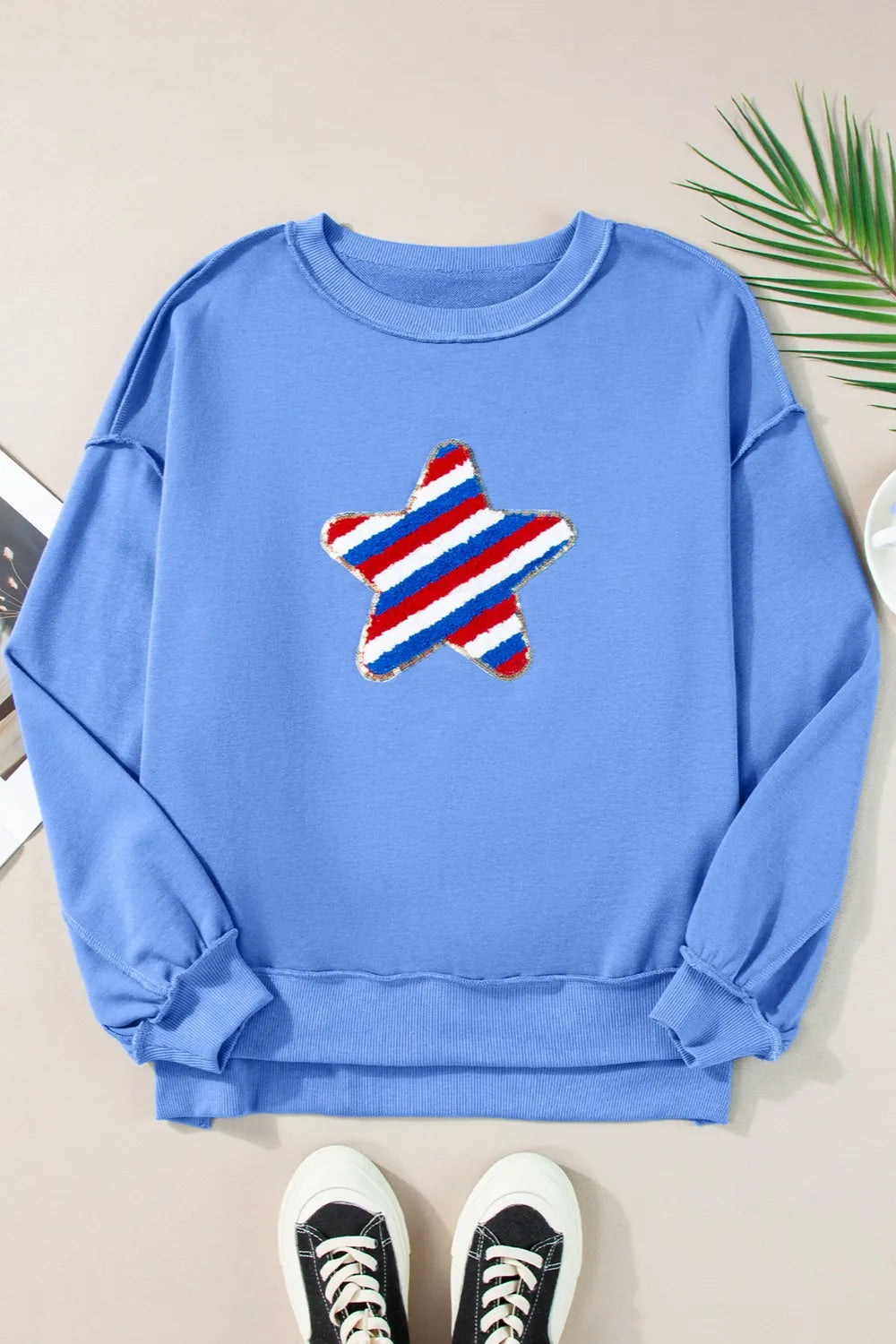 Long sleeve sweatshirt with exposed seams in a cotton blend fabric in neutral color.