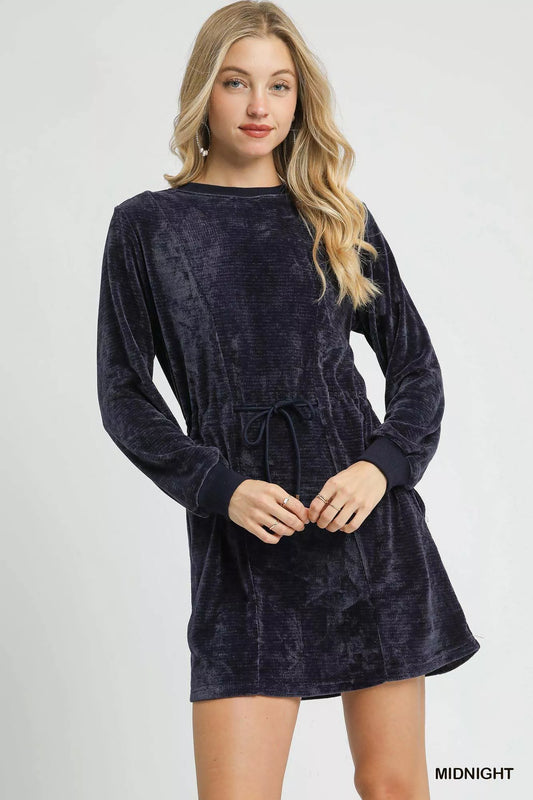 Navy velour drawstring long sleeve mini dress on a model.