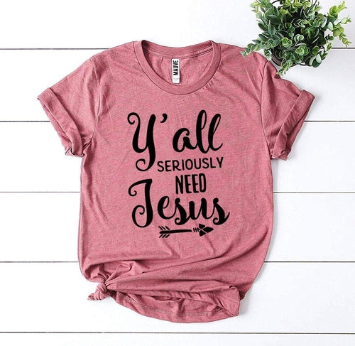 Pink Bella Canvas cotton T-shirt with "Y'all Seriously Need Jesus" text and arrow design.