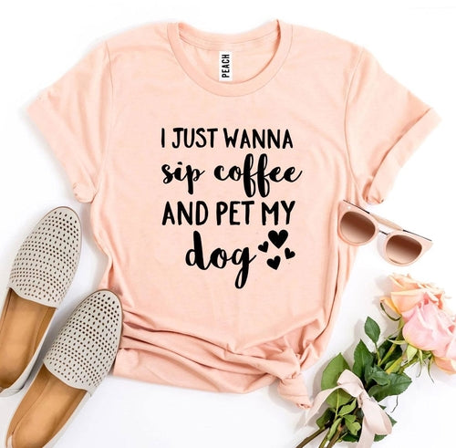 Pink Bella Canvas t-shirt with black text reading "I Just Wanna Sip Coffee And Pet My Dog" surrounded by hearts.
