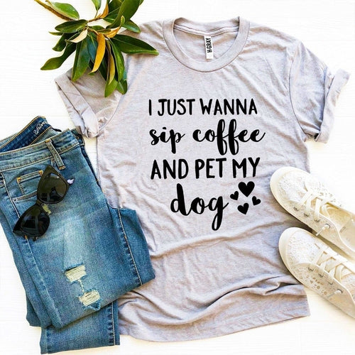 Gray Bella Canvas T-shirt with "I Just Wanna Sip Coffee And Pet My Dog" text, styled with jeans, sneakers, and sunglasses.