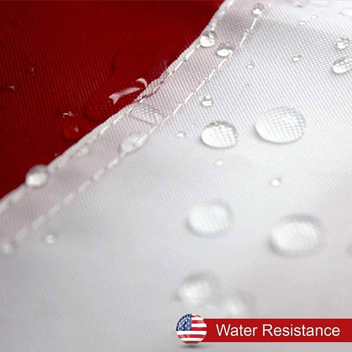 Close-up of nylon USA flag with embroidered stars, showing water resistance.