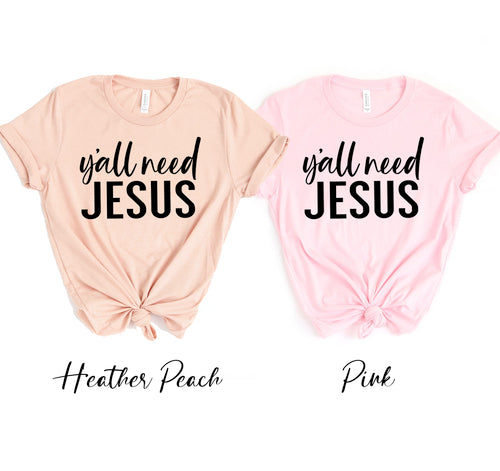 Two unisex Bella Canvas t-shirts in peach and pink with "Y'all Need Jesus" text.