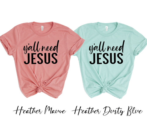 Two unisex Bella Canvas t-shirts with "Y'all Need Jesus" text, one in heather mauve and one in heather dusty blue.