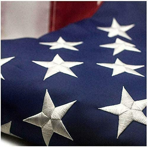Heavy-duty embroidered USA flag made of nylon for outdoor use with brass grommets.
