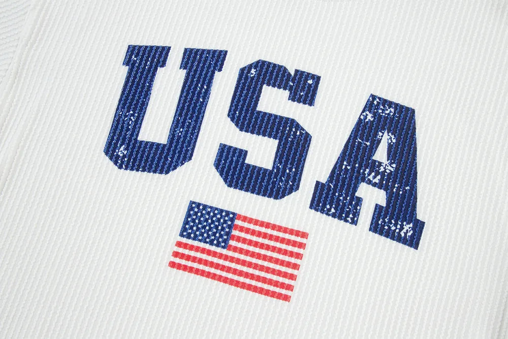 Long sleeve sweatshirt with US flag print in polyester blend fabric and corded texture.