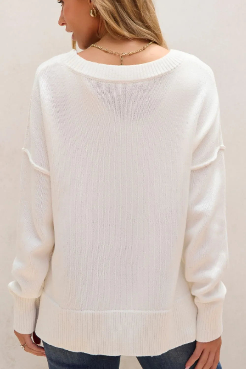 US flag sweater with side slits and drop shoulders in a soft acrylic-cotton blend.