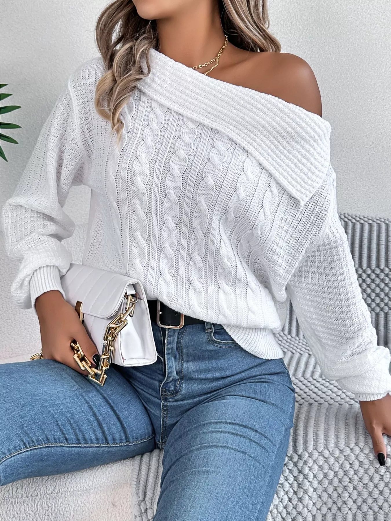 Off-shoulder cable knit sweater in soft acrylic with slight stretch and classic texture