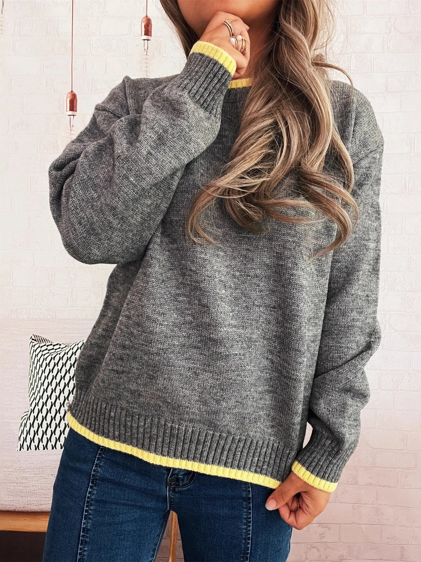 Ribbed long sleeve sweater with contrast trim, made of 100% polyester.