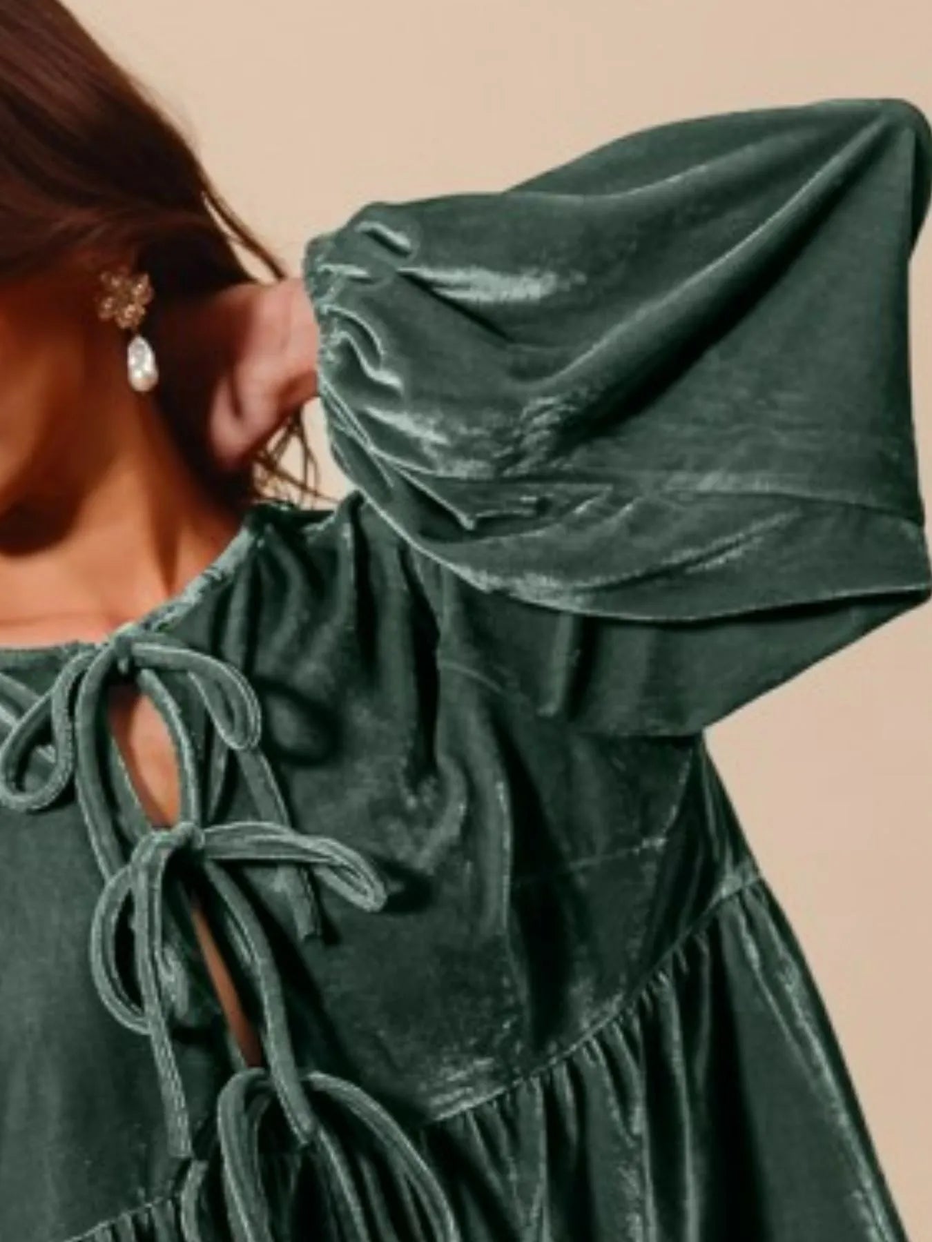 Emerald green velvet peasant blouse with tie-front neckline and balloon sleeves.