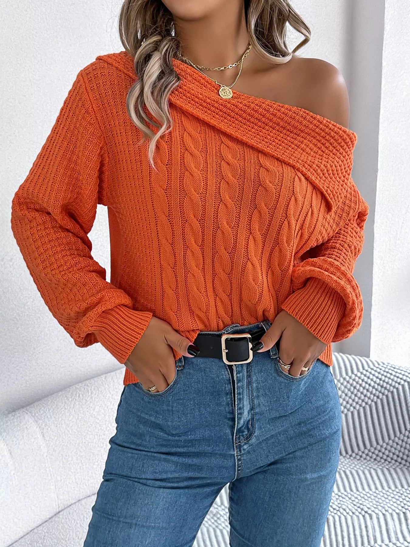 Off-shoulder cable knit sweater in soft acrylic with slight stretch and classic texture