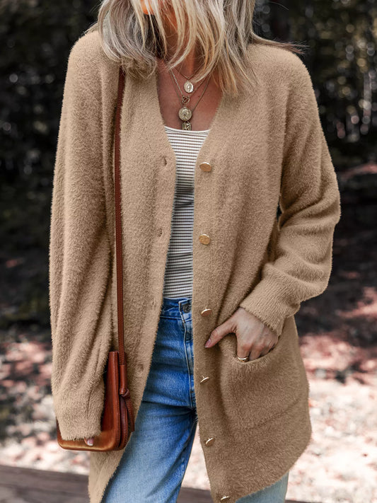 Fuzzy buttoned cardigan in a viscose blend with pockets, ideal for cozy layering.
