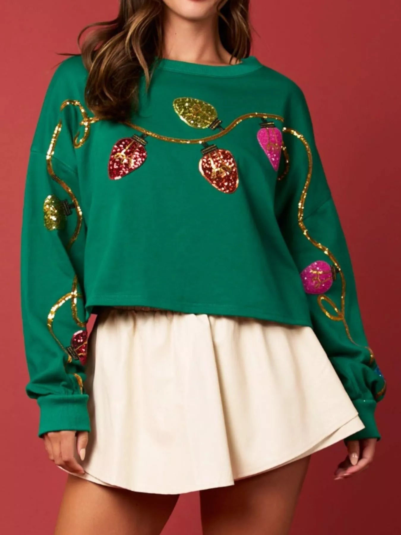 Sequin embellished polyester sweatshirt with long sleeves and a relaxed fit for holidays.
