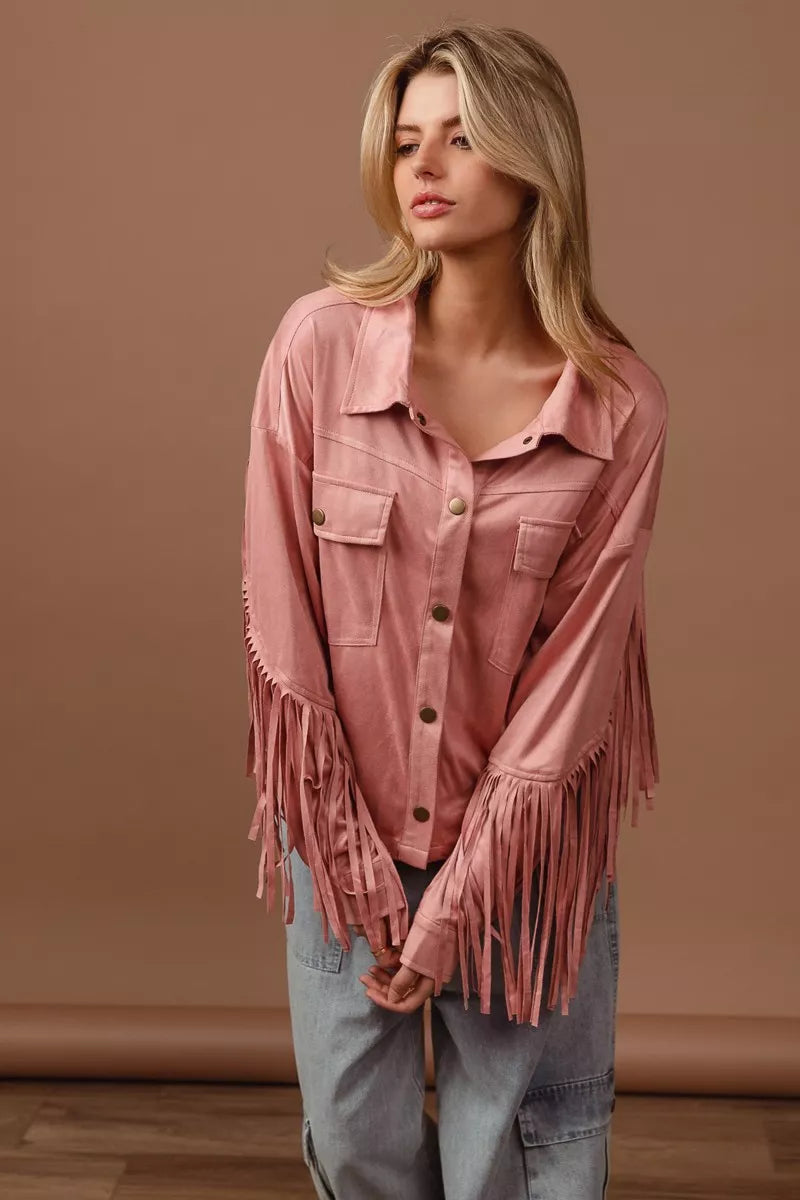 BiBi suede fringe long sleeve jacket in pink on a model.
