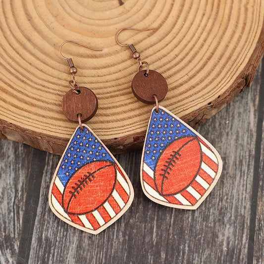 Wooden dangle earrings with alloy accents, measuring 3.3 inches in length.