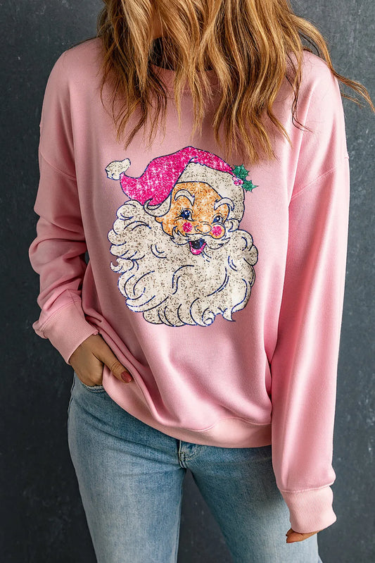 Pink long-sleeve sweatshirt with embroidered Santa face on chest.