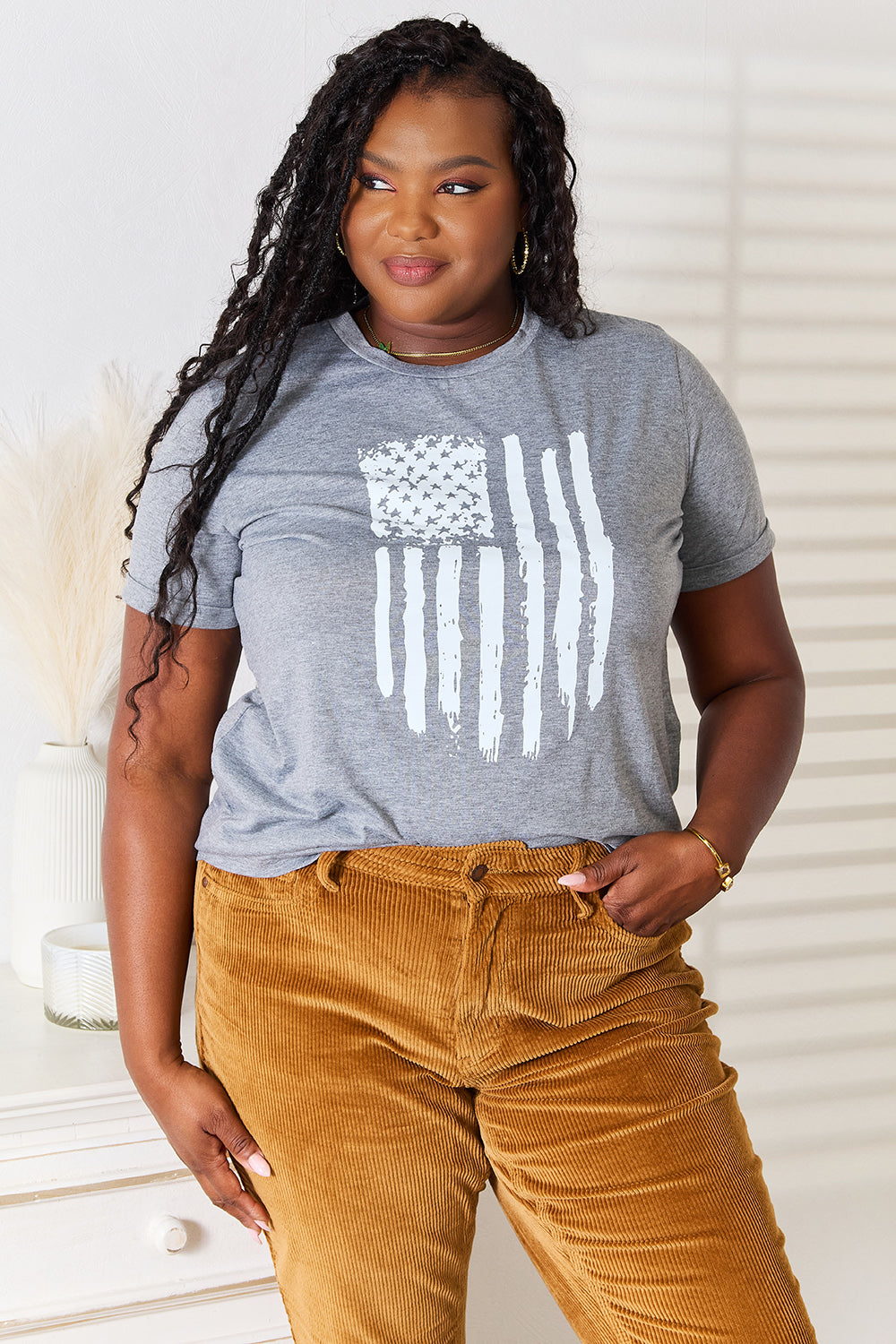 US Flag Graphic T-Shirt with cuffed sleeves and a prominent American flag design on the front.