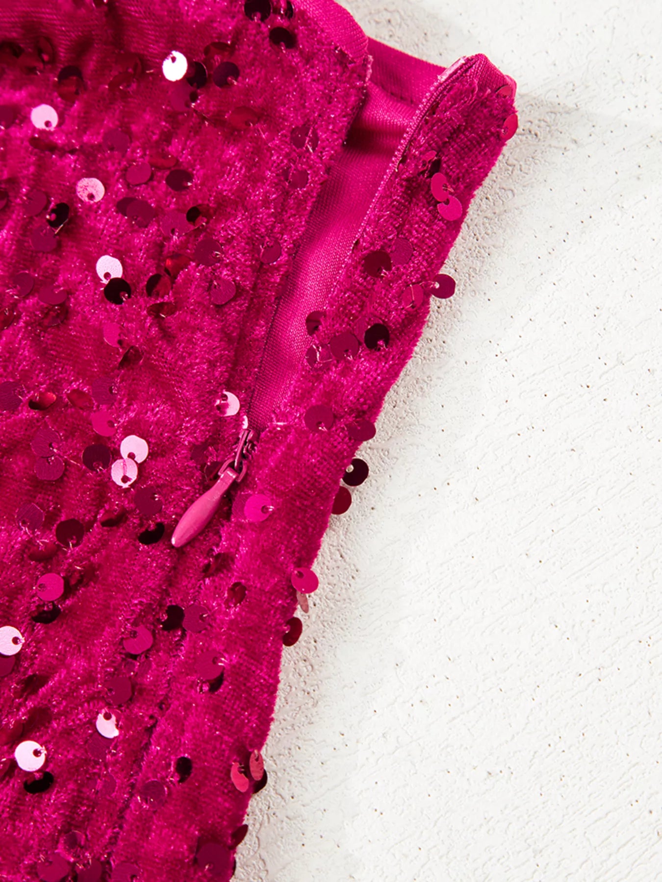 One-shoulder sequin dress with high slit in soft cotton spandex blend fabric.