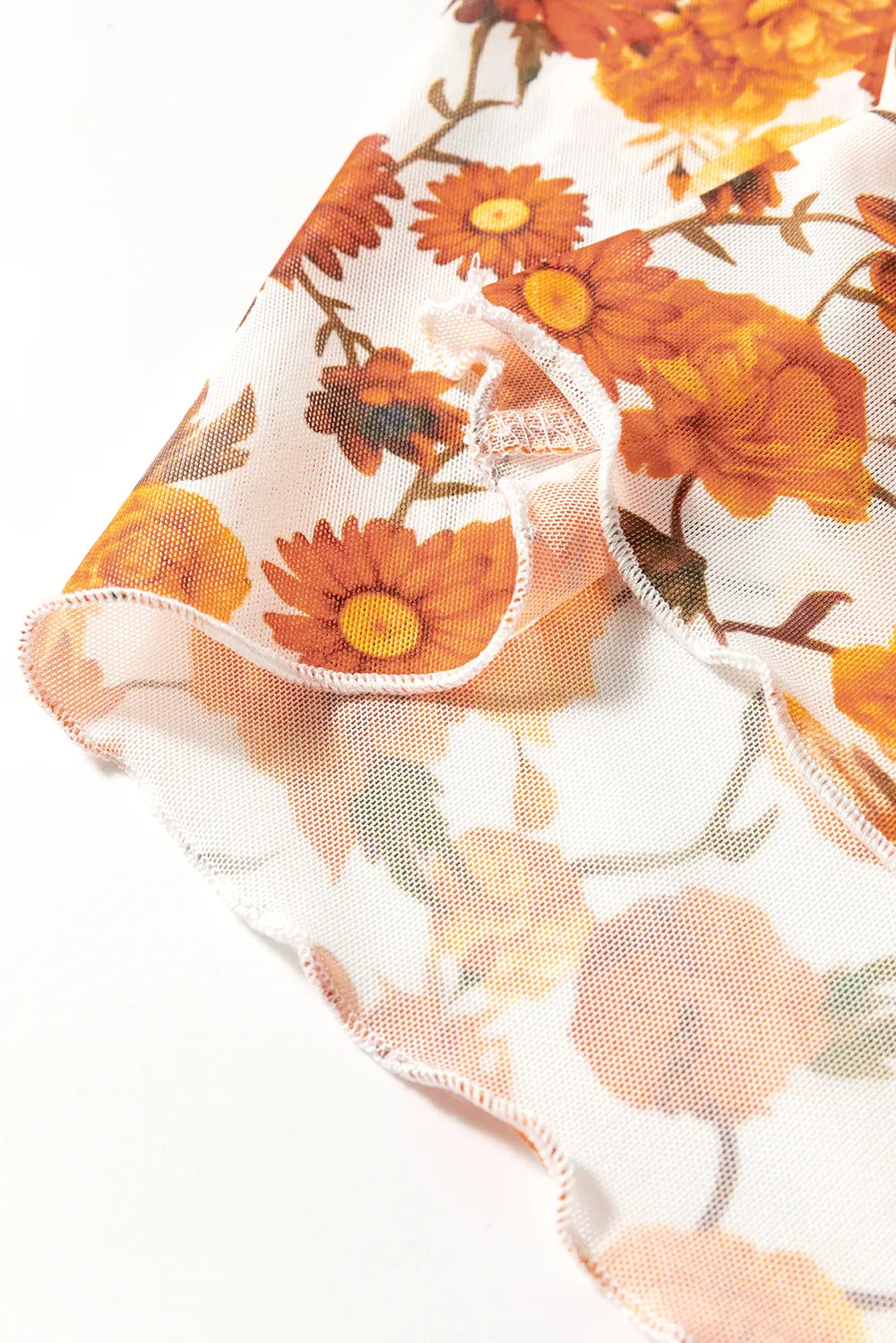 Flare sleeve mock neck top in slightly stretchy printed polyester with opaque fabric.