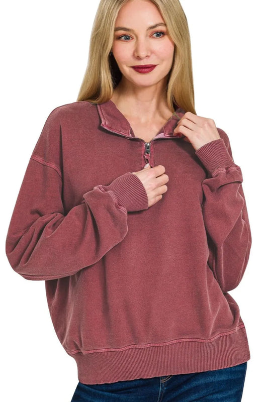 Woman modeling a dusty rose quarter-zip cotton fleece pullover with relaxed fit.