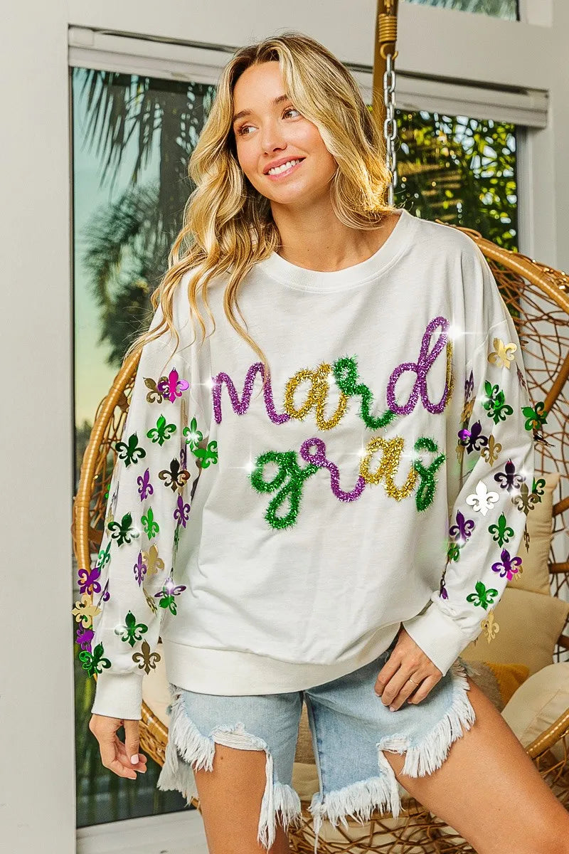 Lightweight pullover with Fleur De Lis sleeve designs in soft-washed fabric for comfort.