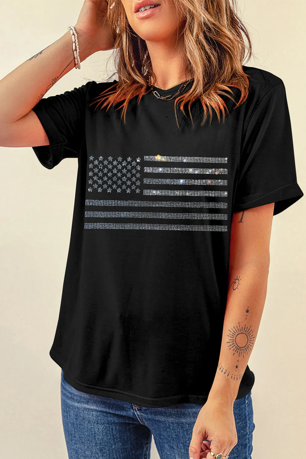 Short sleeve cotton blend T-shirt with rhinestone US flag design and slight stretch.