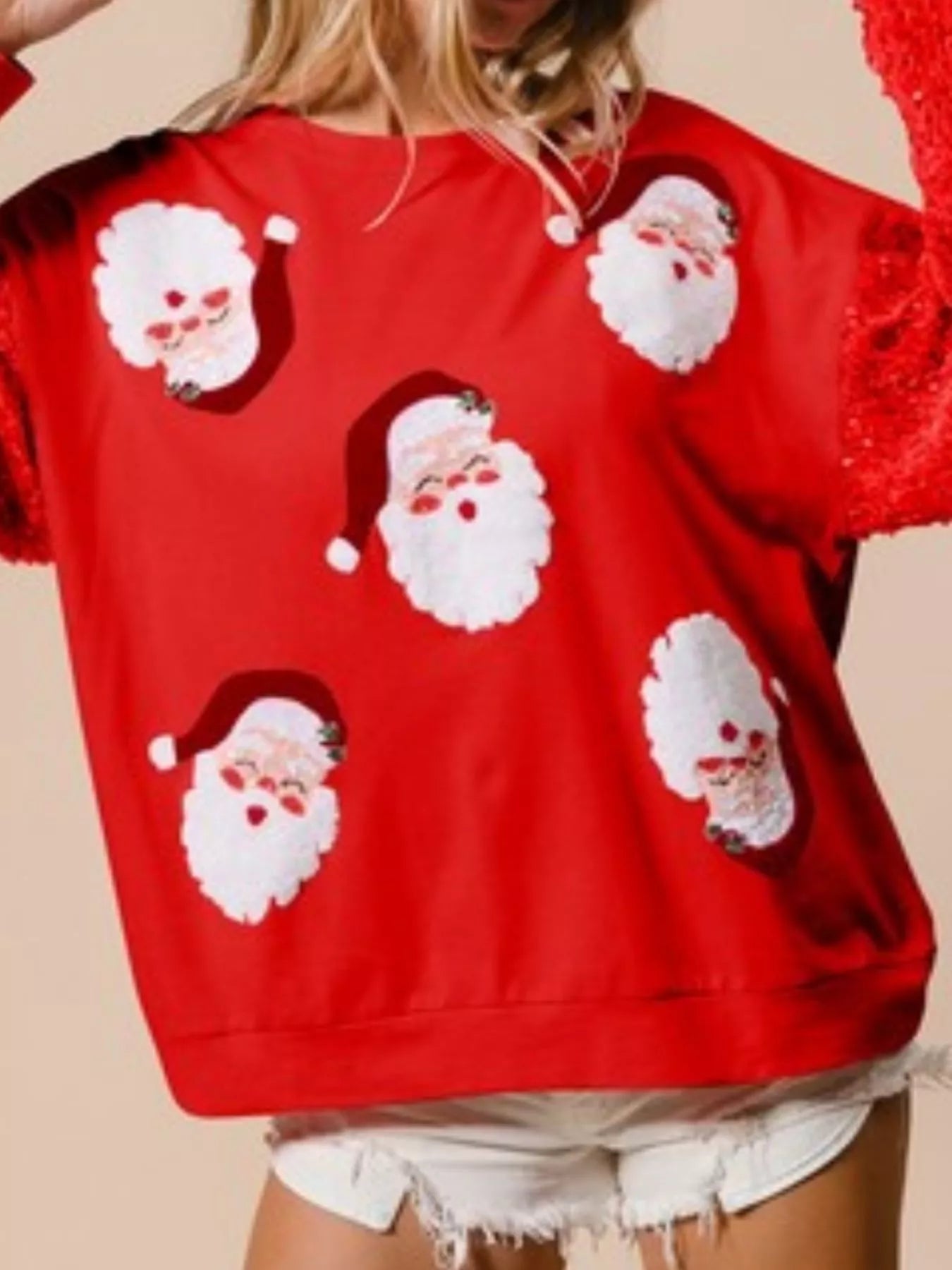 A long sleeve sweatshirt with sequins, featuring a comfortable fit and festive shimmer.