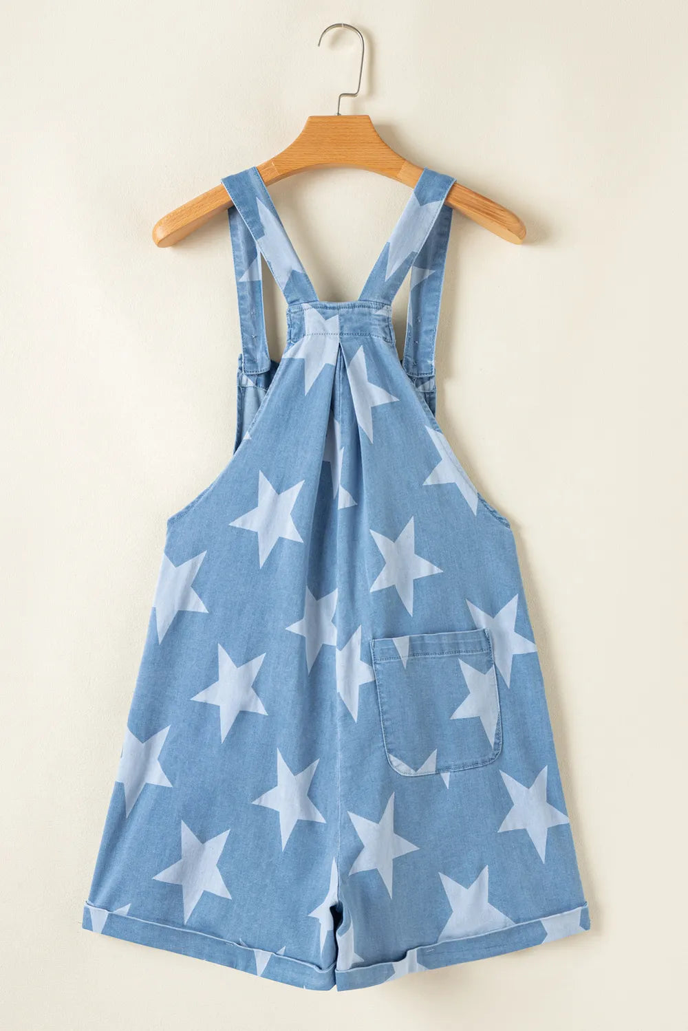 Denim overalls with a star print, square neck, and pocketed design in a cotton blend.