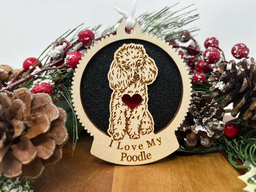 Laser-cut Baltic Birch wood poodle Christmas ornament with hanging ribbon, 3.5 by 3.5 inches.